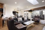 Features an open living area w/ wood-burning fireplace